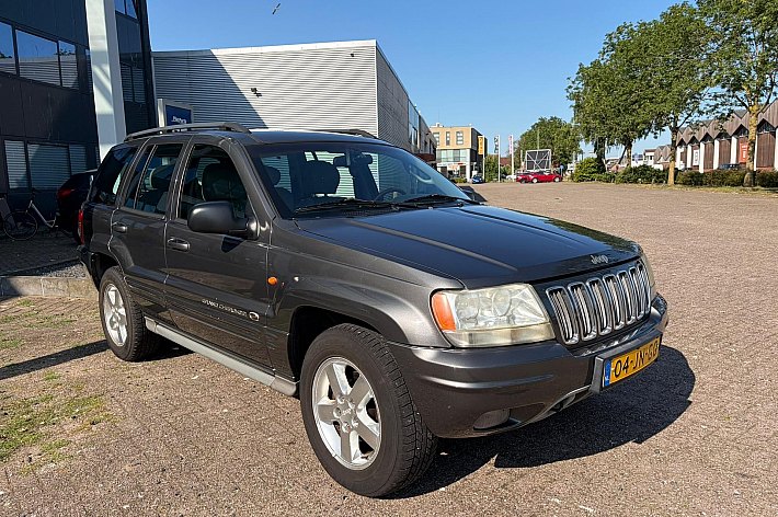 Jeep Grand Cherokee 4.7i V8 Overland High Output , YOUNGTIMER, FULL OPTIONS, 4X4, LEDER, AIRCO, SCHUIFKANTELDAK, PARROT, NWE APK, ETC